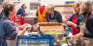 Abby Wyatt courtesy photos
Left to right in front: Nancy Travis; Kate McDill; Carolyn Goodwin; and Sallie Maron share some laughs as they prepare the food.