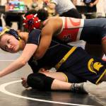Bainbridges Sam Bonifield tries to avoid getting pinned in her first match.