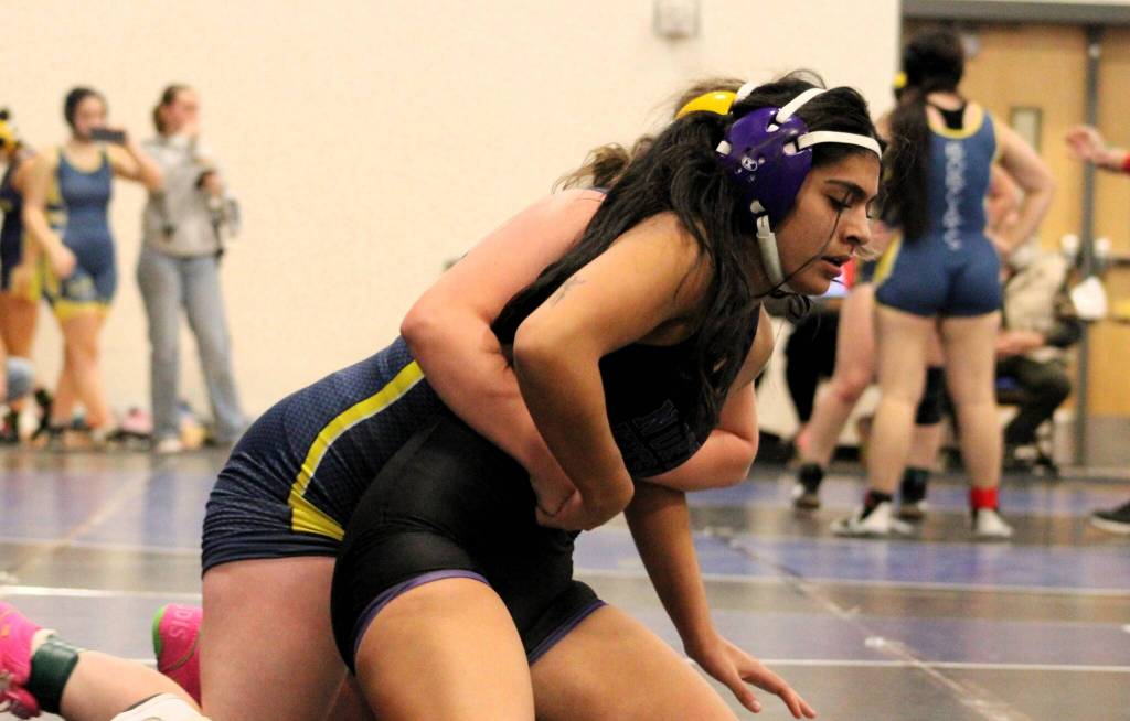North Kitsaps Emily Gomez, right, twists out of a hold before winning against her first opponent of the night.