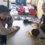 Mark Storer/Kitsap News Group photos
Gary Beanland tries to repair an antique lamp Sharon Witt brought in to have fixed.