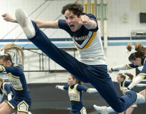 BHS Cheer courtesy photos
Matthew Knight performs a leaping high kick during a cheer routine.