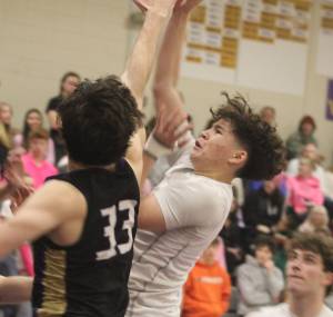 Luke Caputo/Kitsap News Group
North Kitsap senior guard Preston Keehn goes for a contested layup in a 77-47 loss to the Sequim Wolves in Poulsbo Feb. 7.