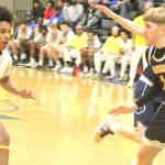 Luke Caputo/Kitsap News Group photos
Charlie Hill of Bainbridge guards Jaydon Turner of Bremerton during a district semifinal game Feb. 21 at Foss High School.