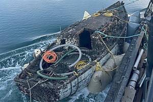 Kitsap County courtesy photo
Global Diving crews raise a derelict sailboat from the seabed in the Lemolo area in mid-February. The work is part of a multijurisdictional effort to remove hazards from local waterways.