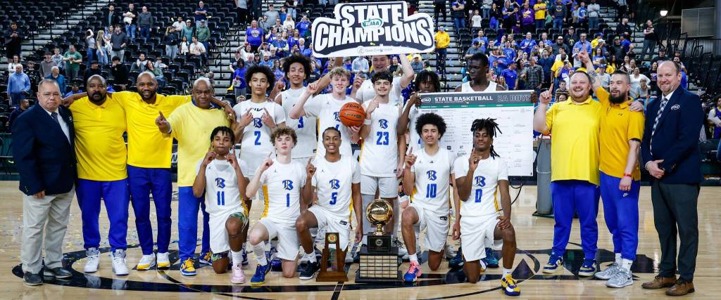 The team poses for a group photo following Bremertons first state title in boys basketball since 1974.