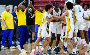 Daniel Phipps courtesy photos
Bremerton celebrates winning the 2A state boys basketball championship March 8 in Yakima.