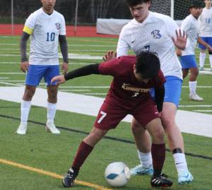 Luke Caputo/Kitsap News Group photos
Buccaneer William Bonila and Knight Jake Haynes battle for the ball in a 3-1 Bremerton win over Kingston March 21.