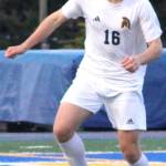 Bainbridge senior defenseman Zane Decker looks to make a play against Bremerton March 28.