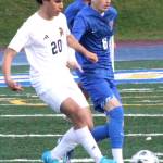 Spartan senior midfielder Jazz Epstein and Knight junior forward Evan Criswall fight for the ball in a match March 28 at Bremerton High School.