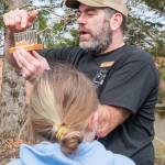 GPC community engagement manager Gabriel Newton teaches students about the salmonids lifecycle.