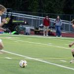Caden Castellani of South Kitsap in pursuit of the ball against an Emerald Ridge player in a match April 1 in Port Orchard.