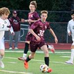 Luke Caputo/Kitsap News Group photos
Jesse Booth of South Kitsap pushes the ball upfield in a 4-0 loss to Emerald Ridge April 1 in Port Orchard.