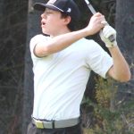 Spartan Thurston Vo hits an iron shot April 3 at White Horse Golf Club in Kingston.