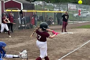 Luke Capuot/Kitsap News Group photos
South Kitsap batter Eva Spencer hits an incoming pitch in a 16-3 win over the Curtis Vikings in Port Orchard.