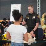 A Bremerton paramedic talks with students at the camp.