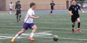 Luke Caputo/Kitsap News Group
Viking Ryder Doherty dribbles the ball downfield in a 2-1 NK road win against Fife in the 2A district semifinals May 15.