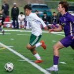 Luke Caputo/Kitsap News Group photos
Viking Timmy Hicks pushes the ball down the field in a 3-1 NK home win over Quincy May 21 in the first round of the 2A boys state soccer tournament.