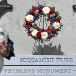 Suquamish Warriors president Jim Henry Jr. laid a wreath between two markers, which bear the name of Chief Kitsap on the left and Chief Seattle on the right.