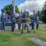 Rose Green courtesy photos
Bill Biltoft accepts the American flag from South Kitsap ROTC sea cadets.