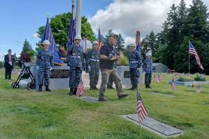 Rose Green courtesy photos
Bill Biltoft accepts the American flag from South Kitsap ROTC sea cadets.