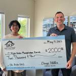 South Kitsap School District courtesy photos
Kyle Archer Mangalindan Barias (left) receives the $2,000 South Kitsap Community Pride Scholarship created by Doug Miller (right) and South Kitsap Properties.