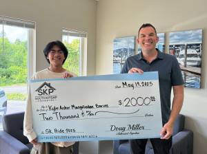 South Kitsap School District courtesy photos
Kyle Archer Mangalindan Barias (left) receives the $2,000 South Kitsap Community Pride Scholarship created by Doug Miller (right) and South Kitsap Properties.