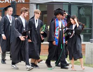 Britney Fletcher-West/Kitsap News Group photos
Central Kitsap High School graduates walk to meet their families following the ceremony June 14.