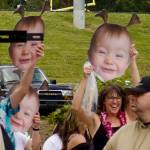 Families held cardboard cutouts of graduates as toddlers at the CK High ceremony June 14.