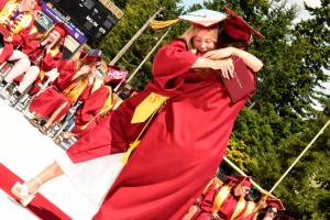 Katrina Daroff/Kitsap News Group photos
Two Kingston High School graduates hug in celebration after receiving their diplomas.