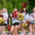 South Kitsap High School cheerleaders pump up the parade crowd.