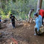 Evergreen Mountain Bike Alliance courtesy photo
A volunteer crew from the EMBA sculpts a dogleg in a downhill bike trail.