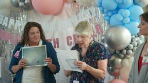 VMFH courtesy photos
Former nurse Julie Harper (center) reads a poem she wrote titled Labor Room Walls at an event honoring the 25th anniversary of St. Michael Medical Centers Family Birth Center July 8.