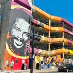 Quincy Jones, namesake of Quincy Square, highlights a colorful wall mural on the city parking garage at 4th Street and Washington Avenue.