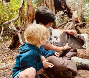 Tender Leaves courtesy photos
Head teacher and founder, Calvin Frey, reads to students at Salsbury Park during summer camp.