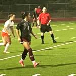 SK senior Ava White pushes the ball downfield against CK.