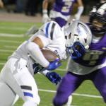 Trojan Jonny Mack attempts to run for extra yardage with Viking Kyree McGinty looking to make the tackle in a game Sept. 18 at North Kitsap High School.