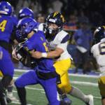Luke Caputo/Kitsap News Group photos
Bainbridge Spartan Zack Ausmeier wraps up Knight Kenneth Najera in a 41-14 Bremerton home win Sept. 19.