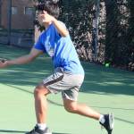Knight Joseph Cao hits a forehand in his singles match loss against Bremerton Sept. 22.