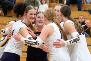 Luke Caputo/Kitsap News Group photos
The Bainbridge Spartans celebrate after winning a point in their home match against Kingston Sept. 25.