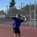 Viking Rocco Targett prepares to serve in his doubles match win against Kingston Oct. 7 at North Kitsap High School.