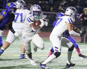 Luke Caputo/Kitsap News Group photos
Trojan running back Chace Webster barrels through Bremerton defenders in a 34-14 Trojan road win over the Knights Oct. 10.