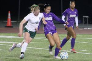 Luke Caputo/Kitsap News Group photos
Viking Abby Marrero battles for the ball with a Port Angeles defender with Viking Addy Jueco looking on in a 2-0 NK home loss to the Roughriders Oct. 16.