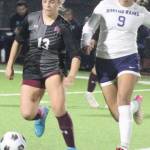 Julia Hoisington of SK dribbles the ball with a Rogers defender in pursuit in a 0-0 draw Oct. 23 in Port Orchard.