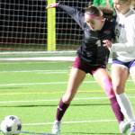 Luke Caputo/Kitsap News Group photos
Mia Smalley of SK fights for the ball with a Rogers defender in a 0-0 draw Oct. 23 in Port Orchard.