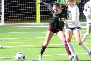 Luke Caputo/Kitsap News Group photos
Mia Smalley of SK fights for the ball with a Rogers defender in a 0-0 draw Oct. 23 in Port Orchard.
