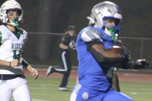 Luke Caputo/Kitsap News Group
Olympic running back Chace Webster broke the schools single-season rushing record Oct. 30 in a 46-6 Trojan home win over Port Angeles.