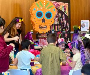 Britney Fletcher-West/Kitsap News Group photos
Children participate in piñata making during the Dia de Muertos festival Nov. 1.