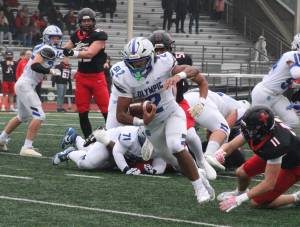 Luke Caputo/Kitsap News Group
Trojan running back Chace Webster rushes for a long gain in a 45-13 Olympic road loss to the Archbishop Murphy Wildcats Nov. 15 in the first round of the 2A state football tournament.