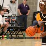 Luke Caputo/Kitsap News Group photos
Cougar Larry Williams III brings the ball to the top of the key in a 63-46 CK home win over the Olympic Trojans Nov. 29.