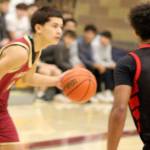Luke Caputo/Kitsap News Group photos
Buccaneer Sylis Sullivan looks to make a play in a 57-55 Kingston home win over the Orting Cardinals Dec. 1.